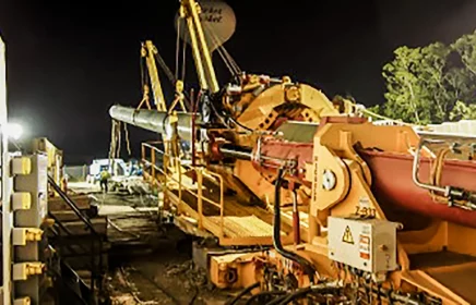 A Direct Pipe machine operates at night