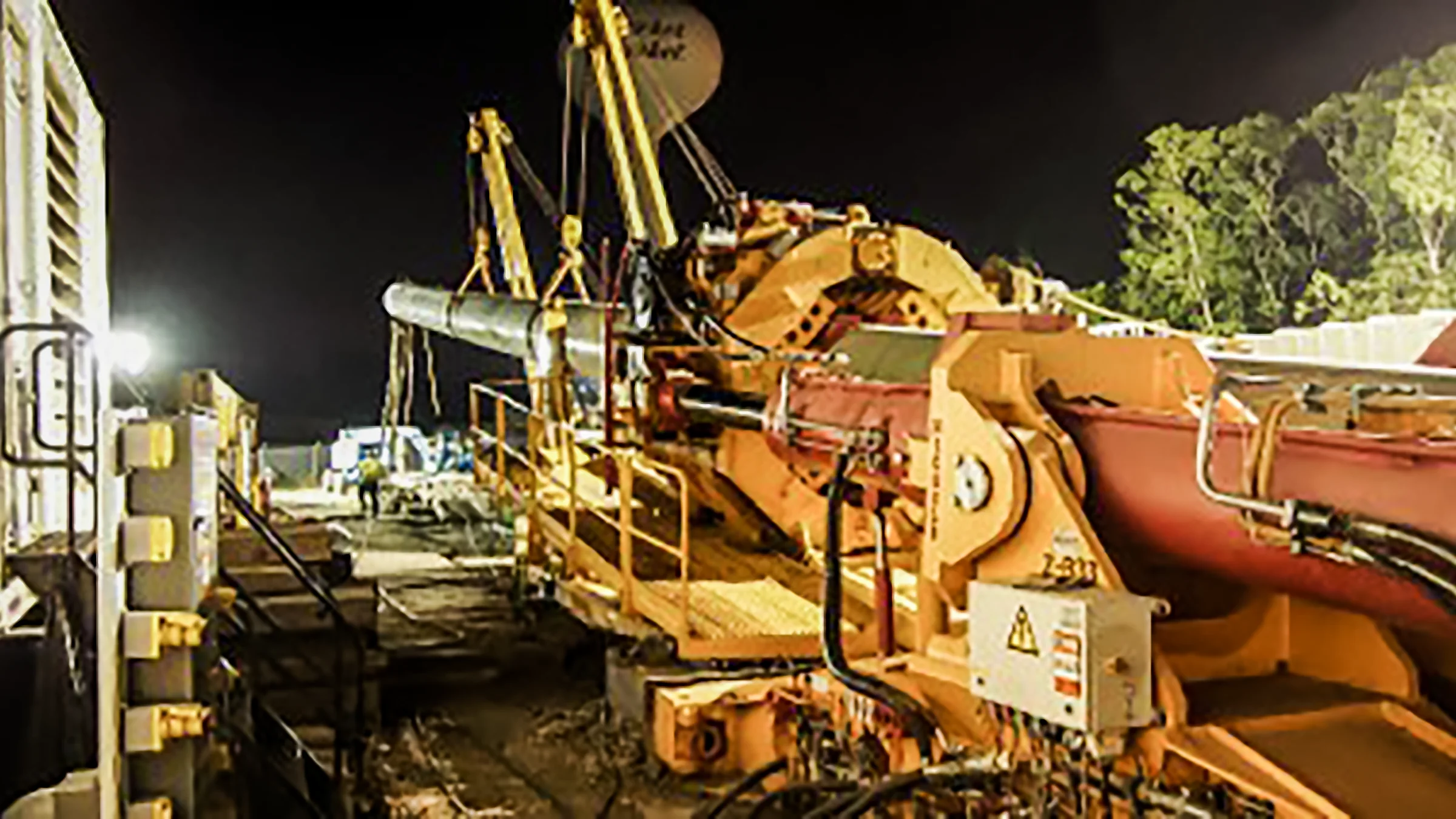 A Direct Pipe machine operates at night