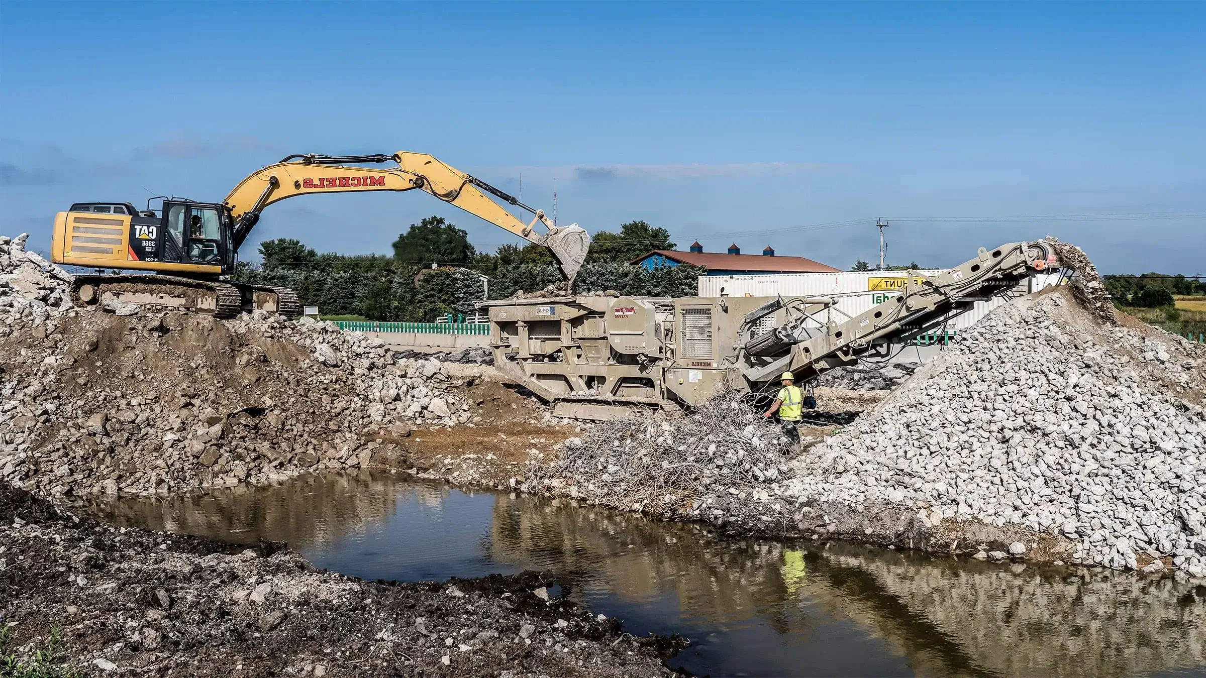 Michels operates a recycle crushing plant alongside an interstate highway to turn used concrete into aggregate