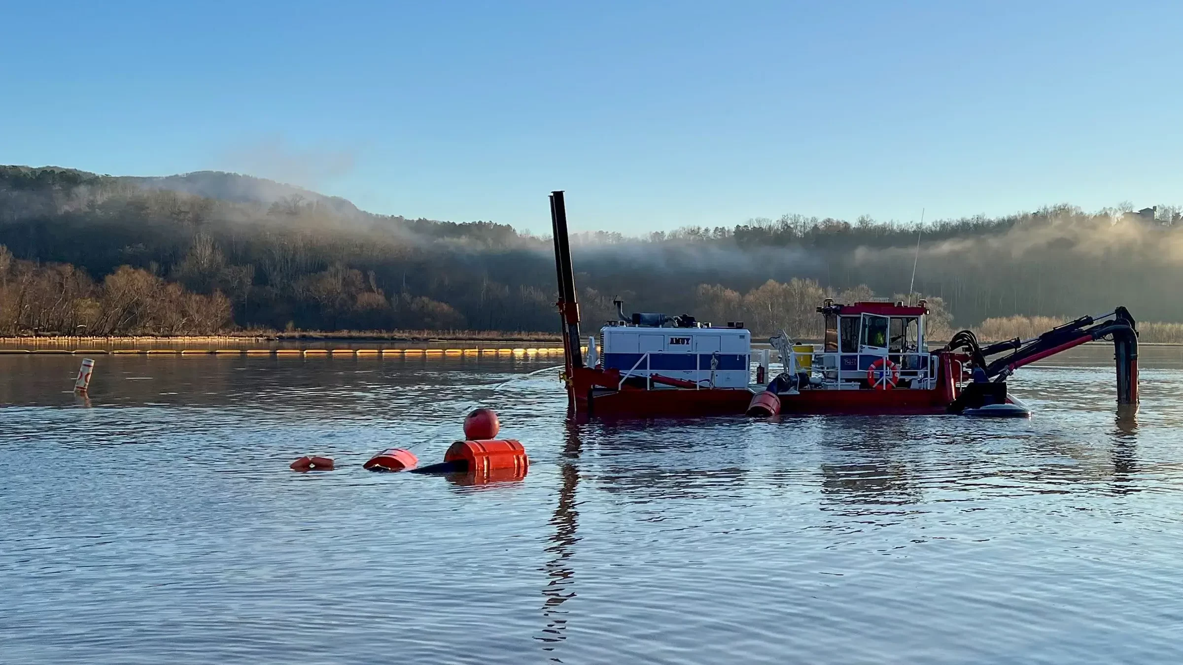 Michels uses a hydraulic dredge to clean a bottom a river