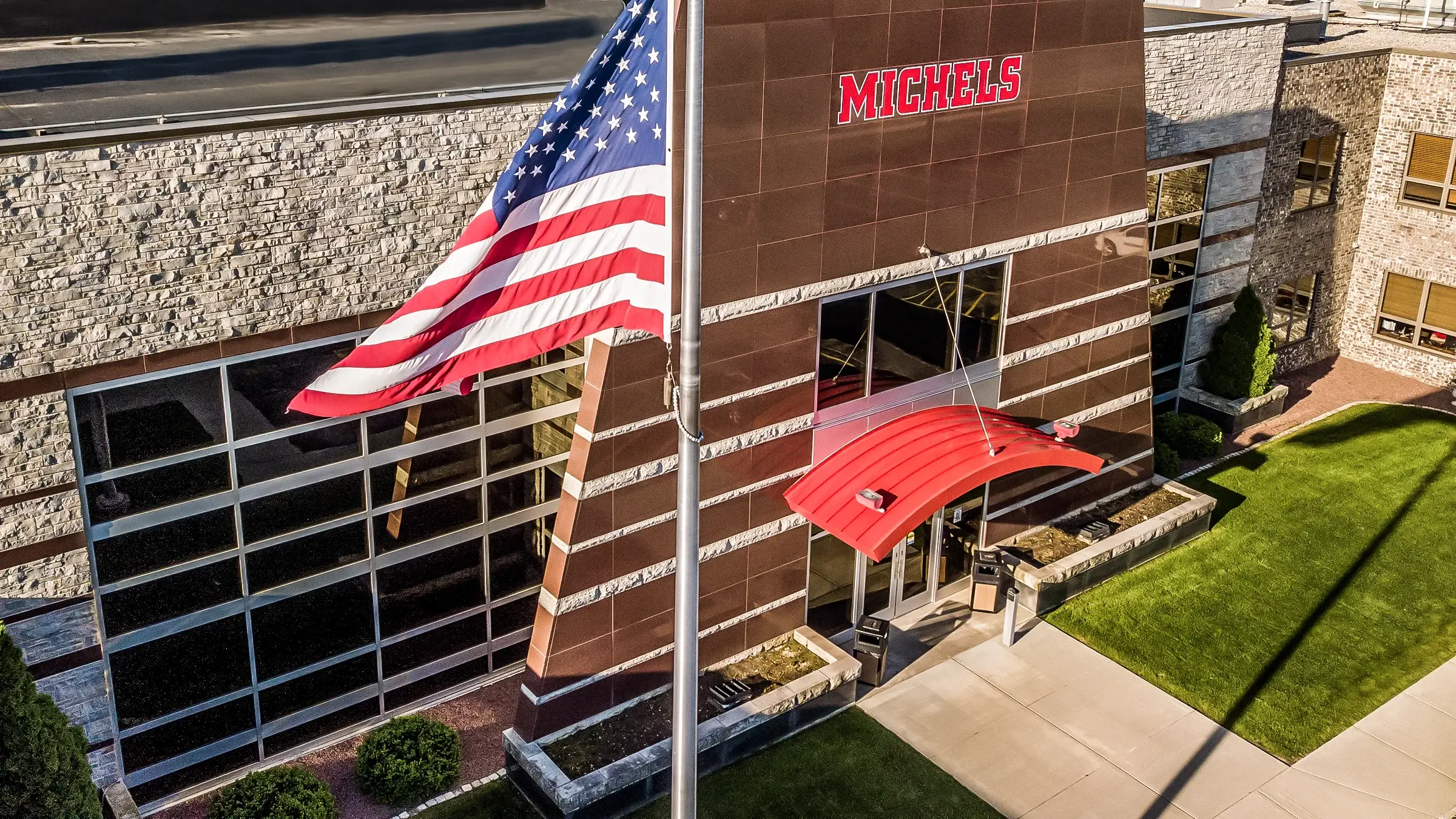 Michels headquarters with a flag in front of it