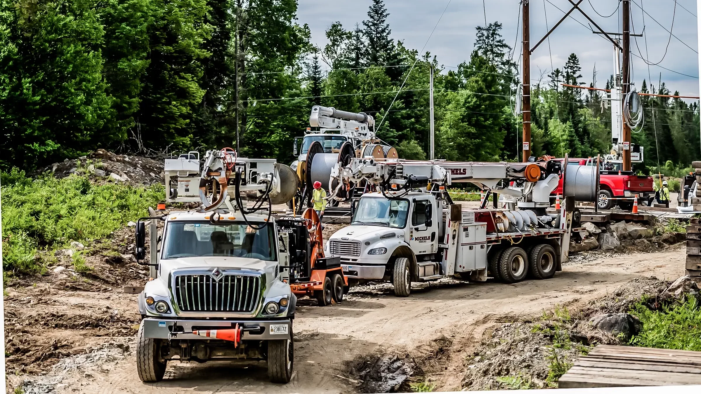 A Michels Canada transmission line crew works in a wooded area