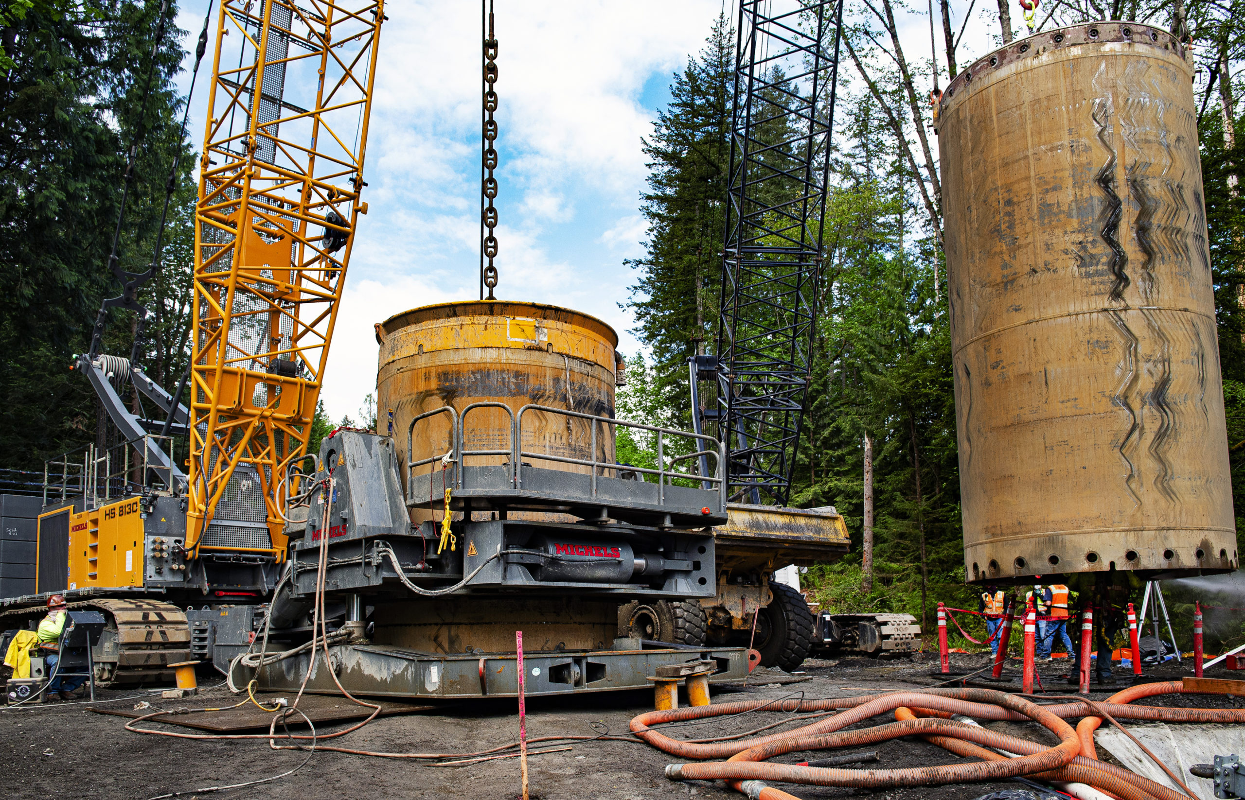 Workers install drilled shafts to serve as piers for a new bridge in Issaquah