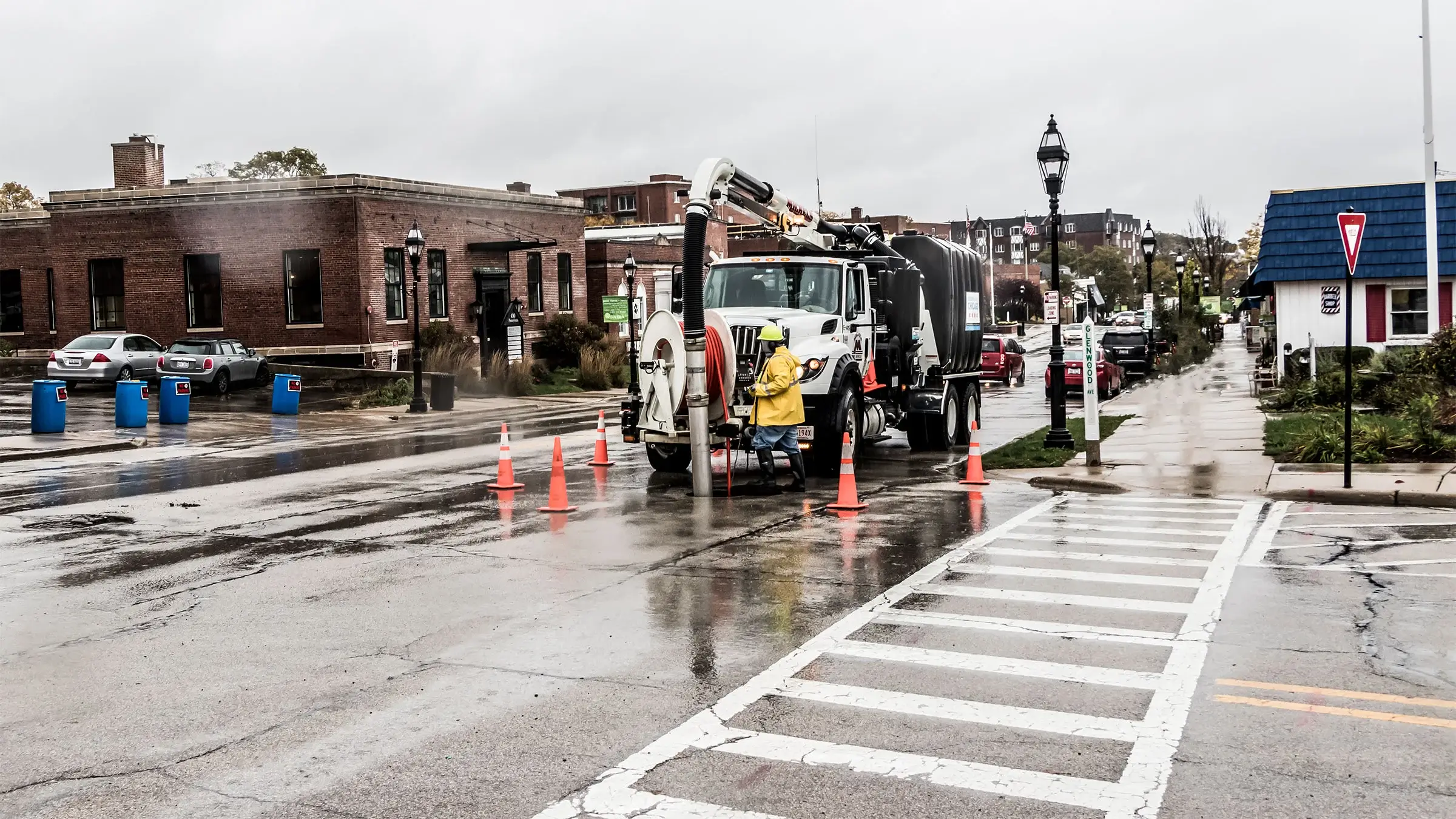 A Michels Trenchless crew members uses a vacuum truck to clean a sewer