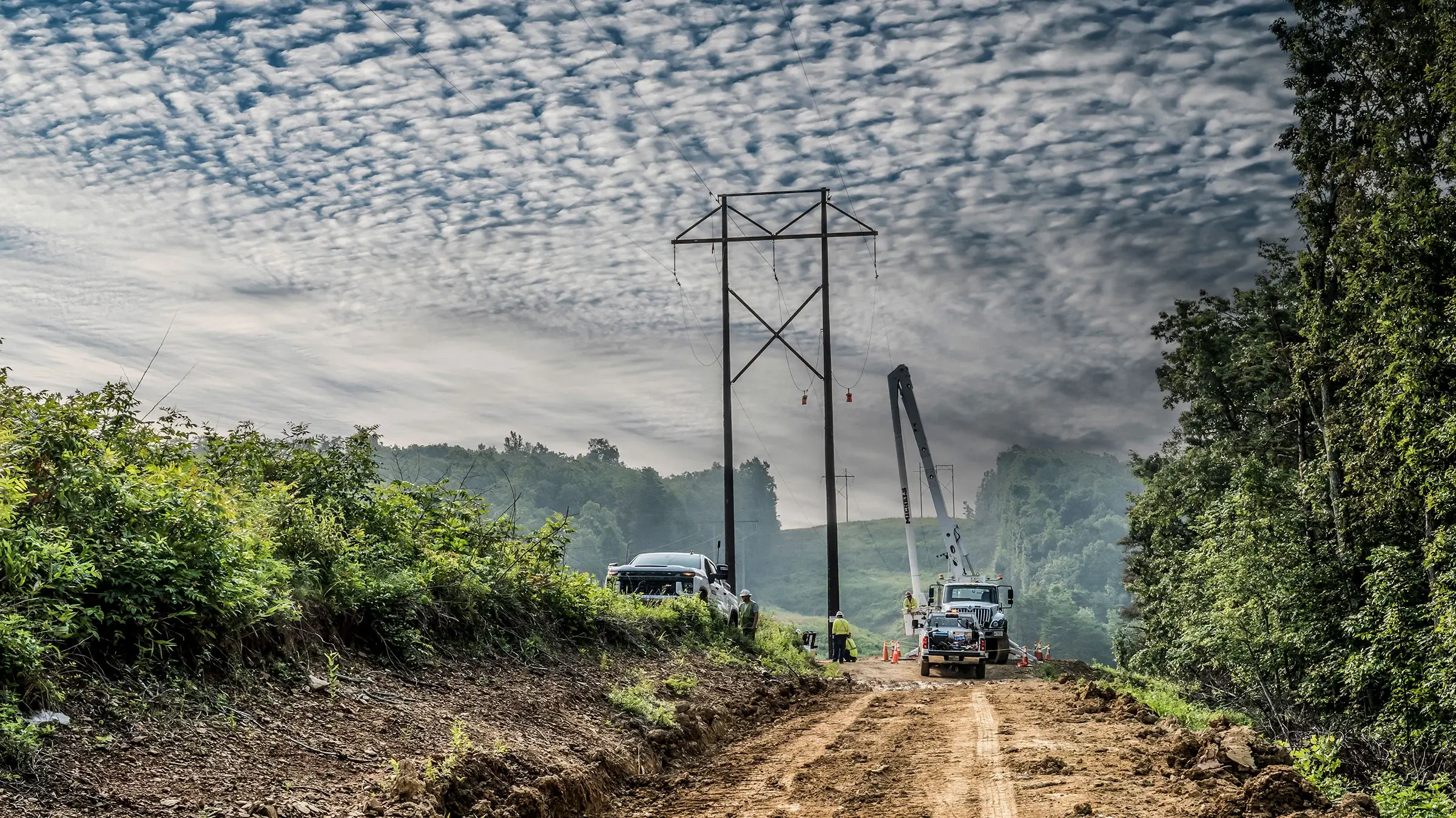 Power crew works on power lines in remote area