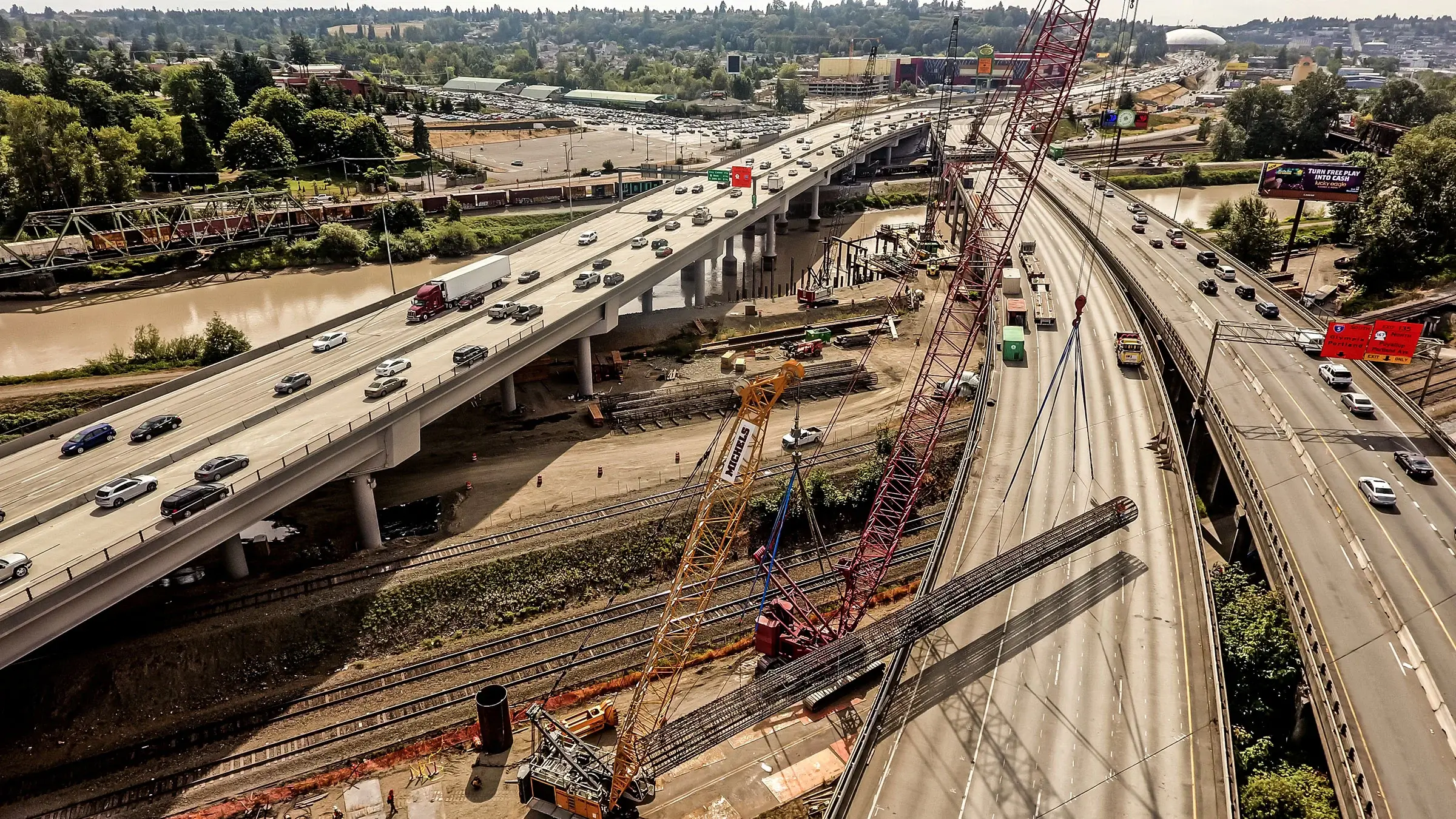 Foundations crew working on a busy road and bridge.