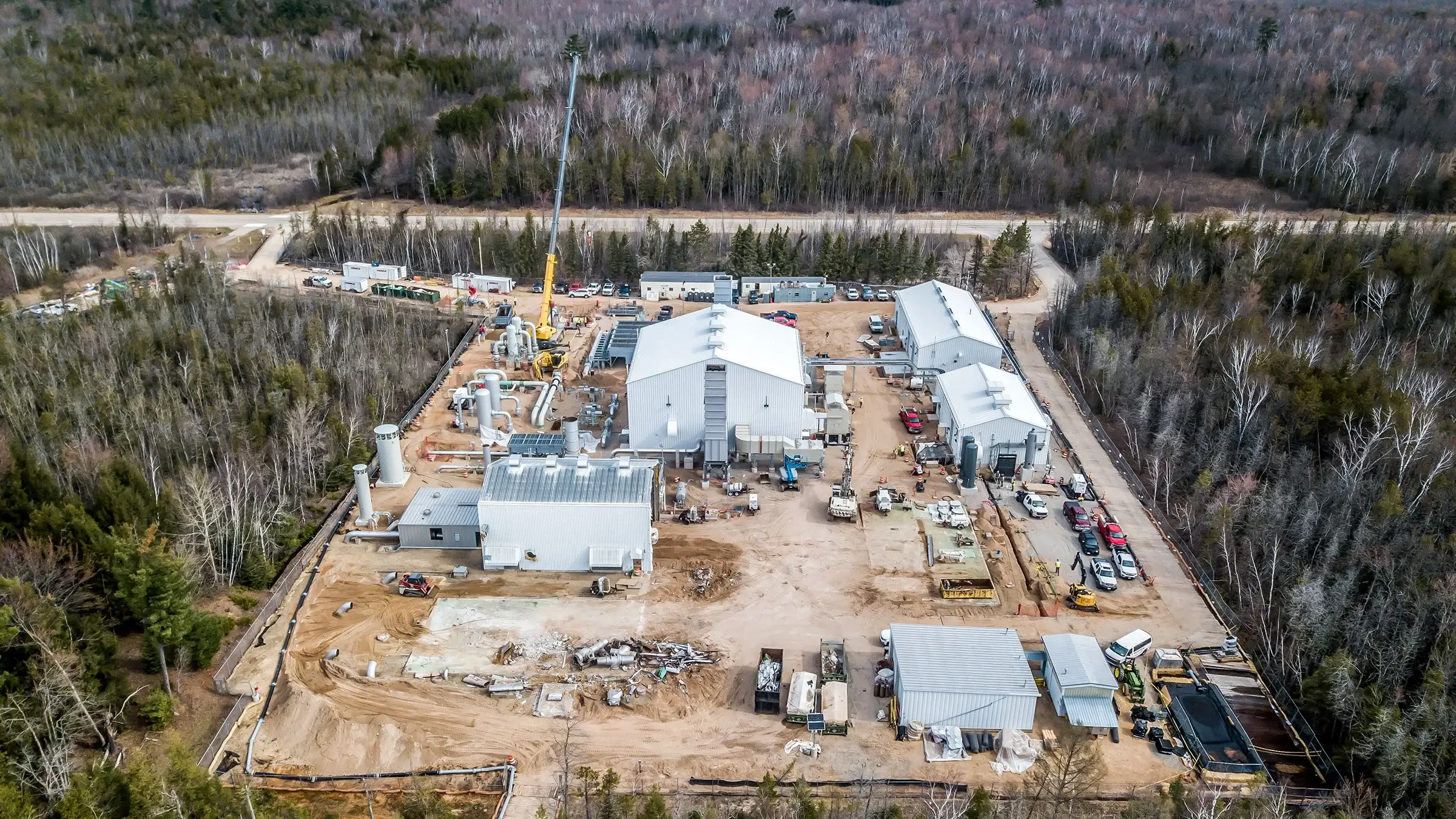 A compressor station in a heavily wooded rural area.