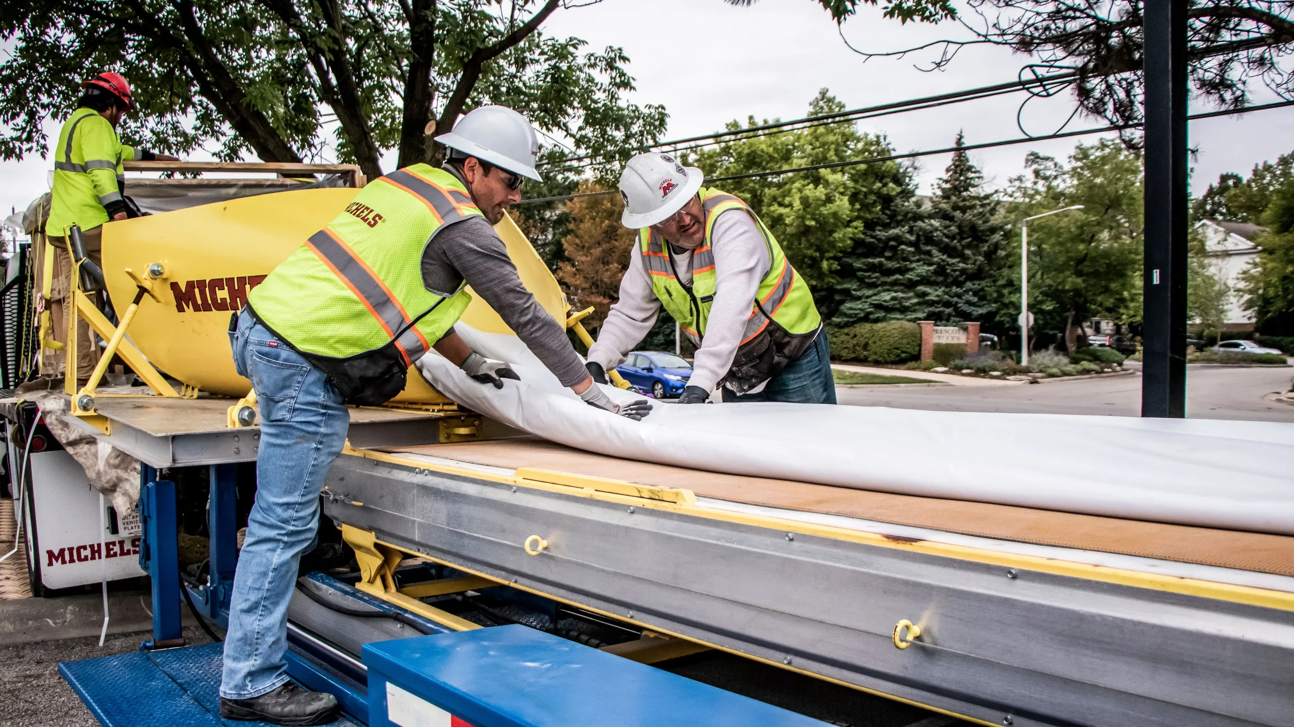 A Michels crew handles CIPP material on a jobsite.