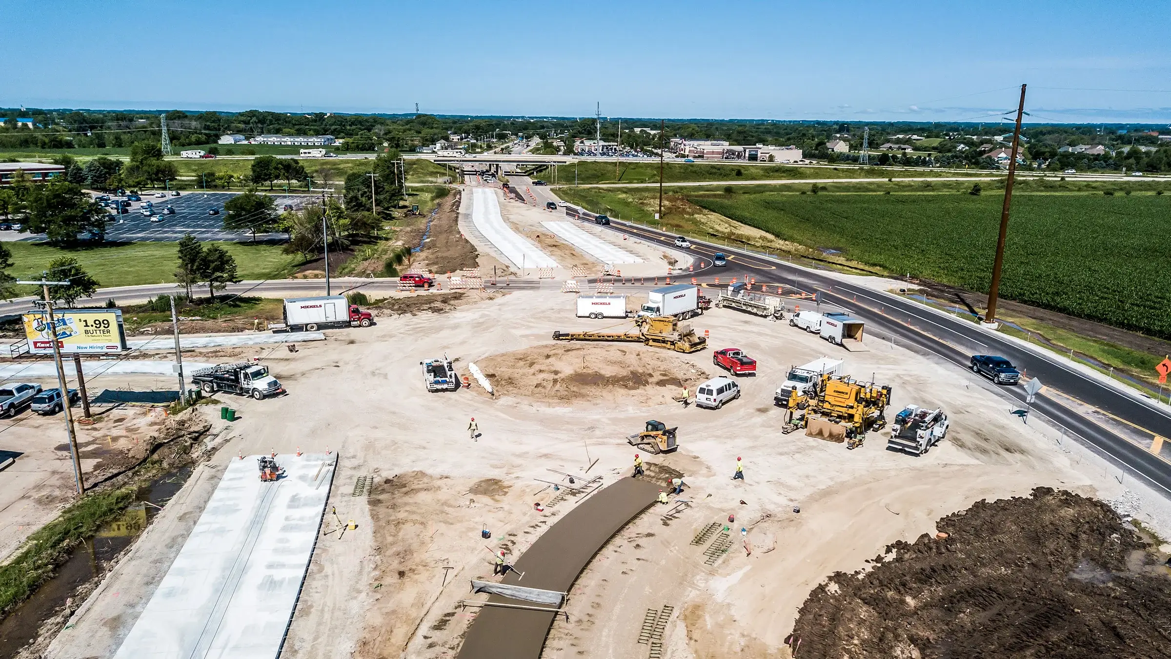 A Michels crew uses a paving machine to pave a roundabout on Highway 23 outside of Fond du Lac, WI.