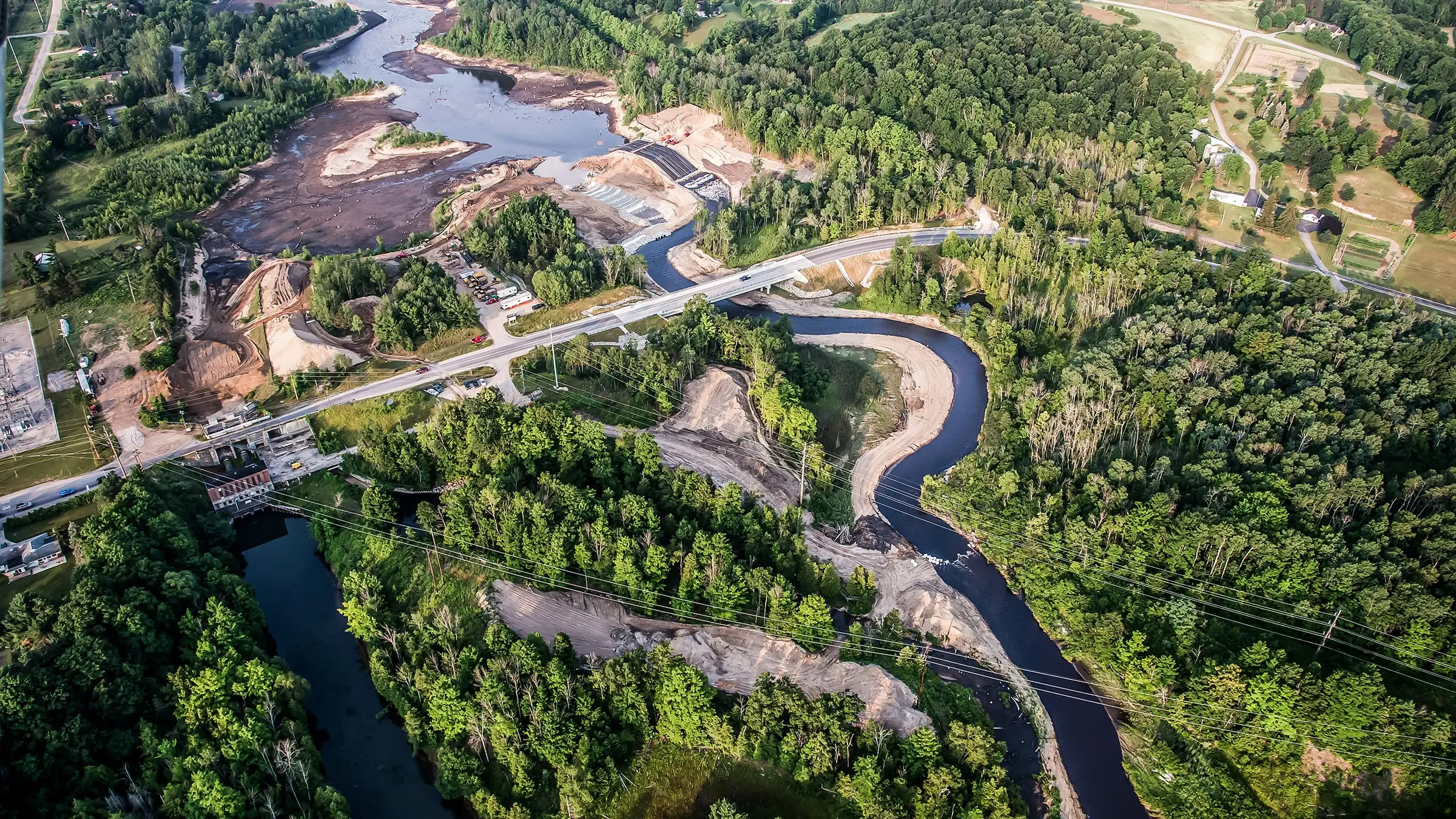 Aerial view of winding river and forests.