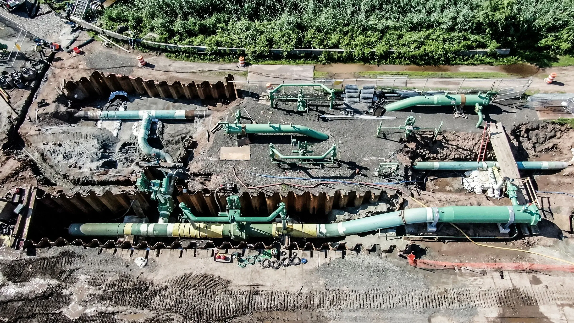 Aerial view of a series of pipelines in a trench