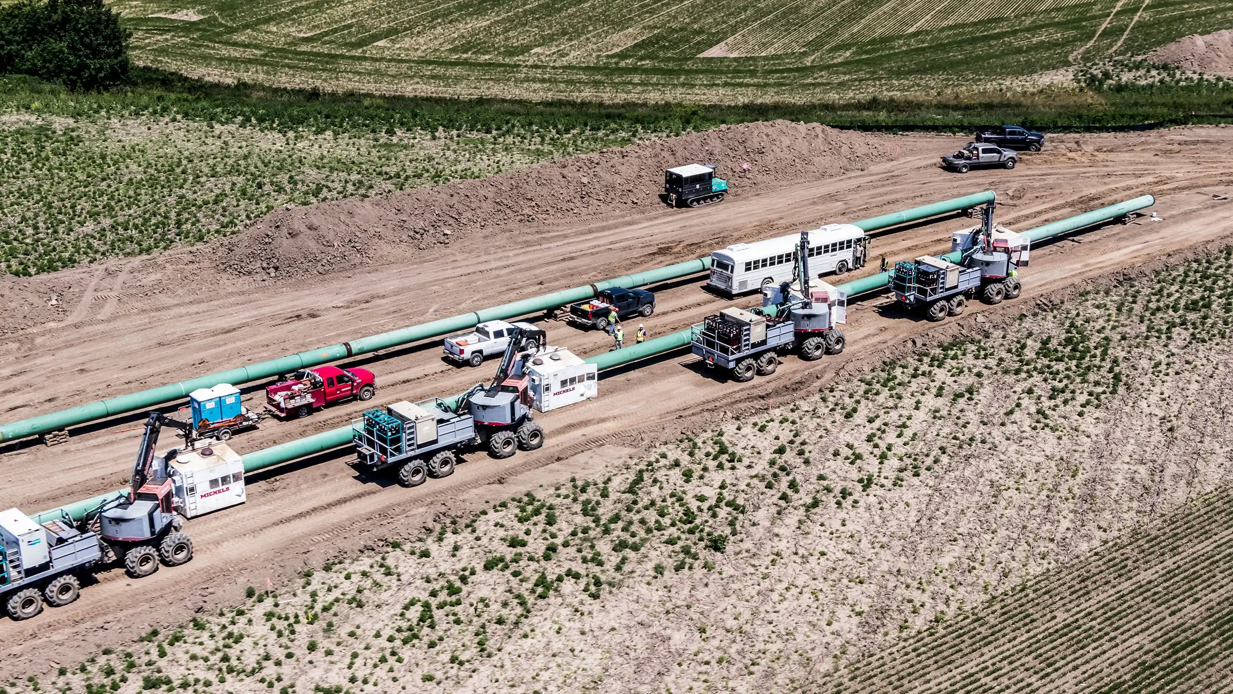 Natural gas pipeline caravan on a sunny day.