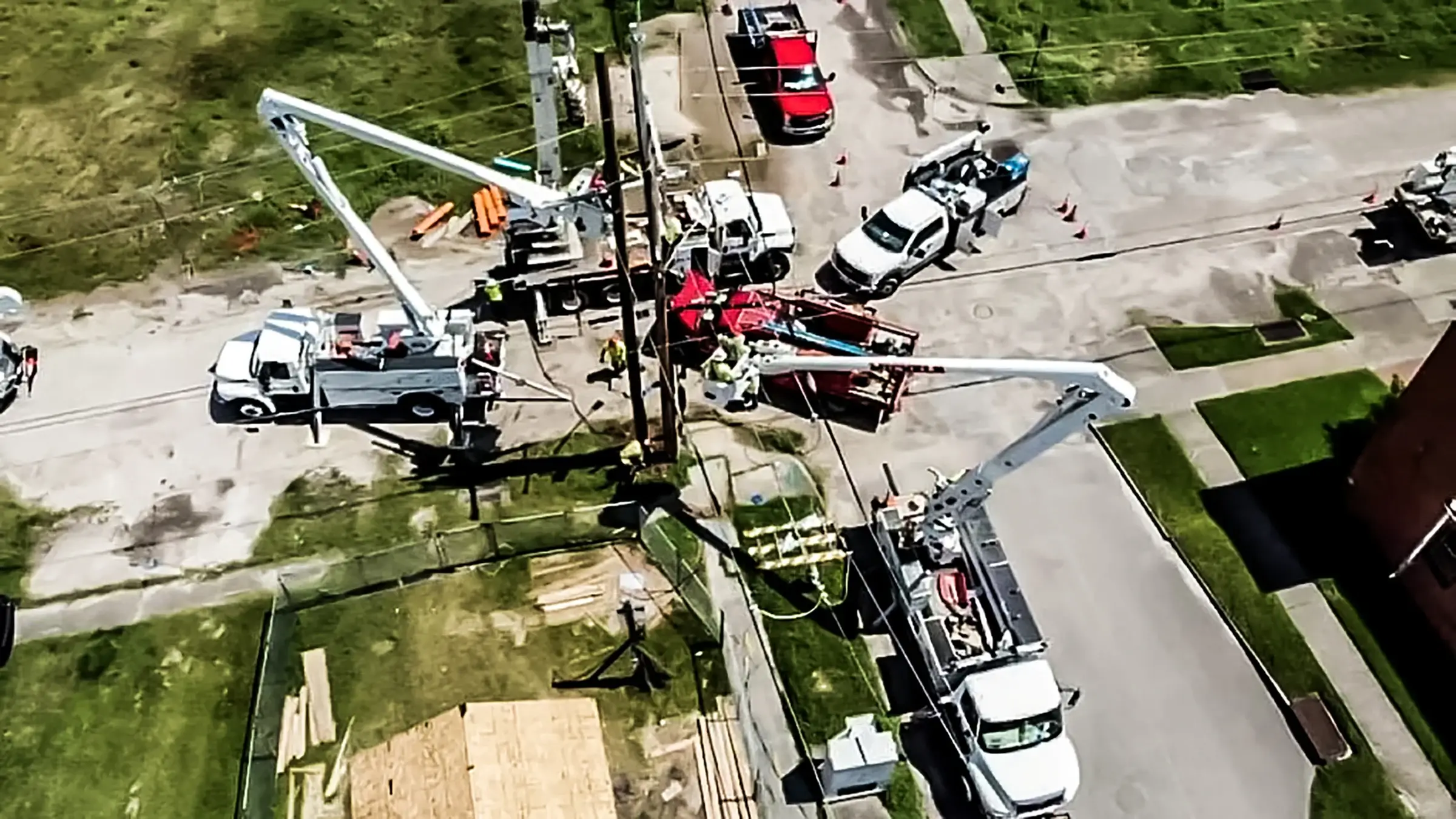 A power line crew restores power after a hurricane