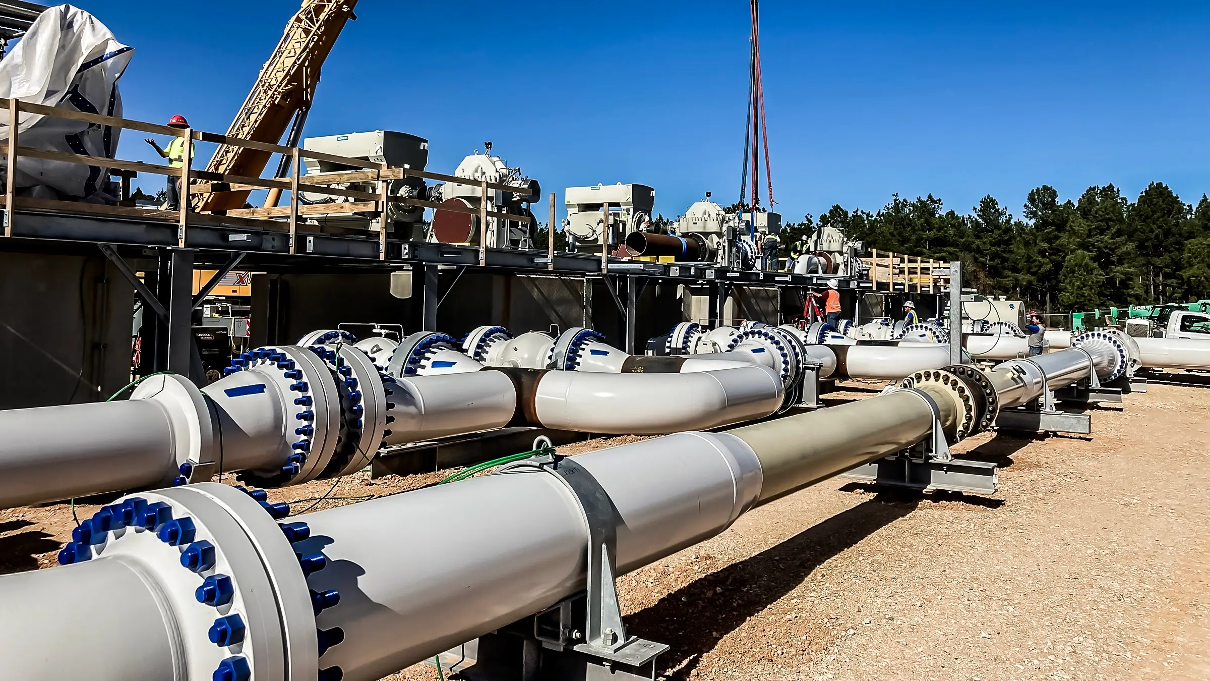 A crane operates on a pump station in Texas.