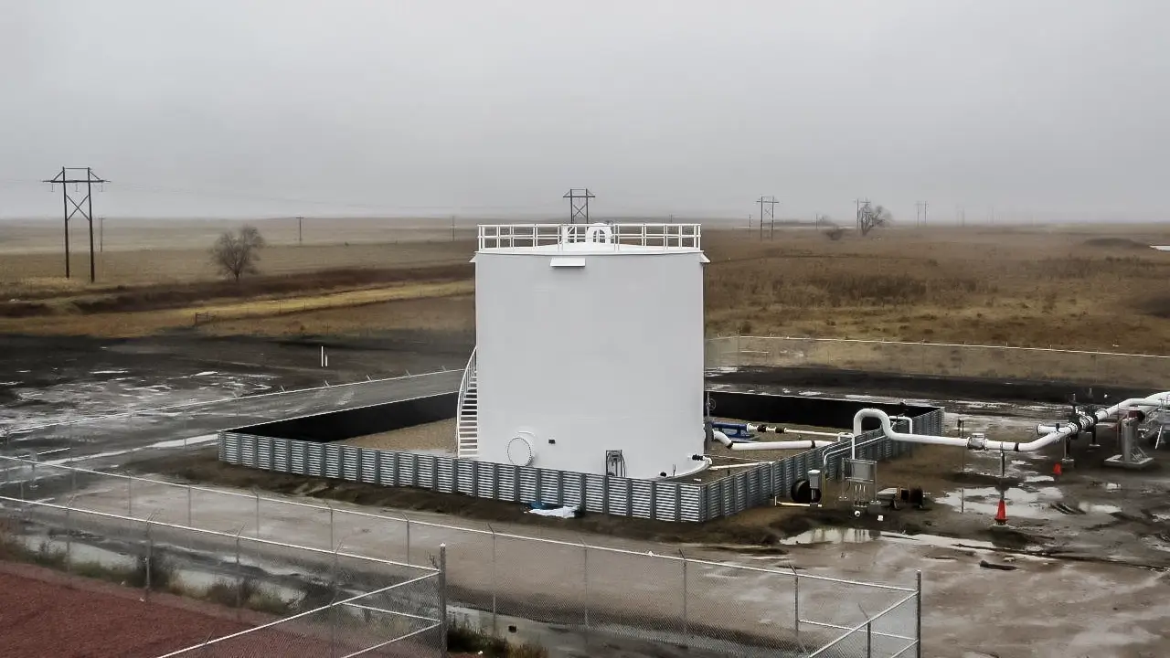 A large, white terminal storage tank