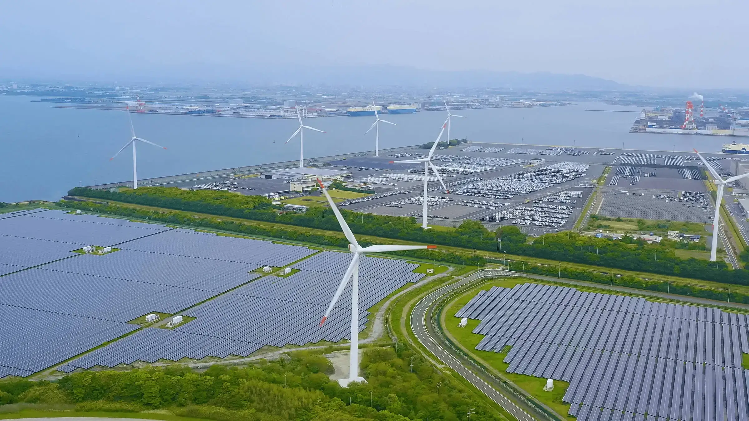 A large scale solar and wind farm near a large port.