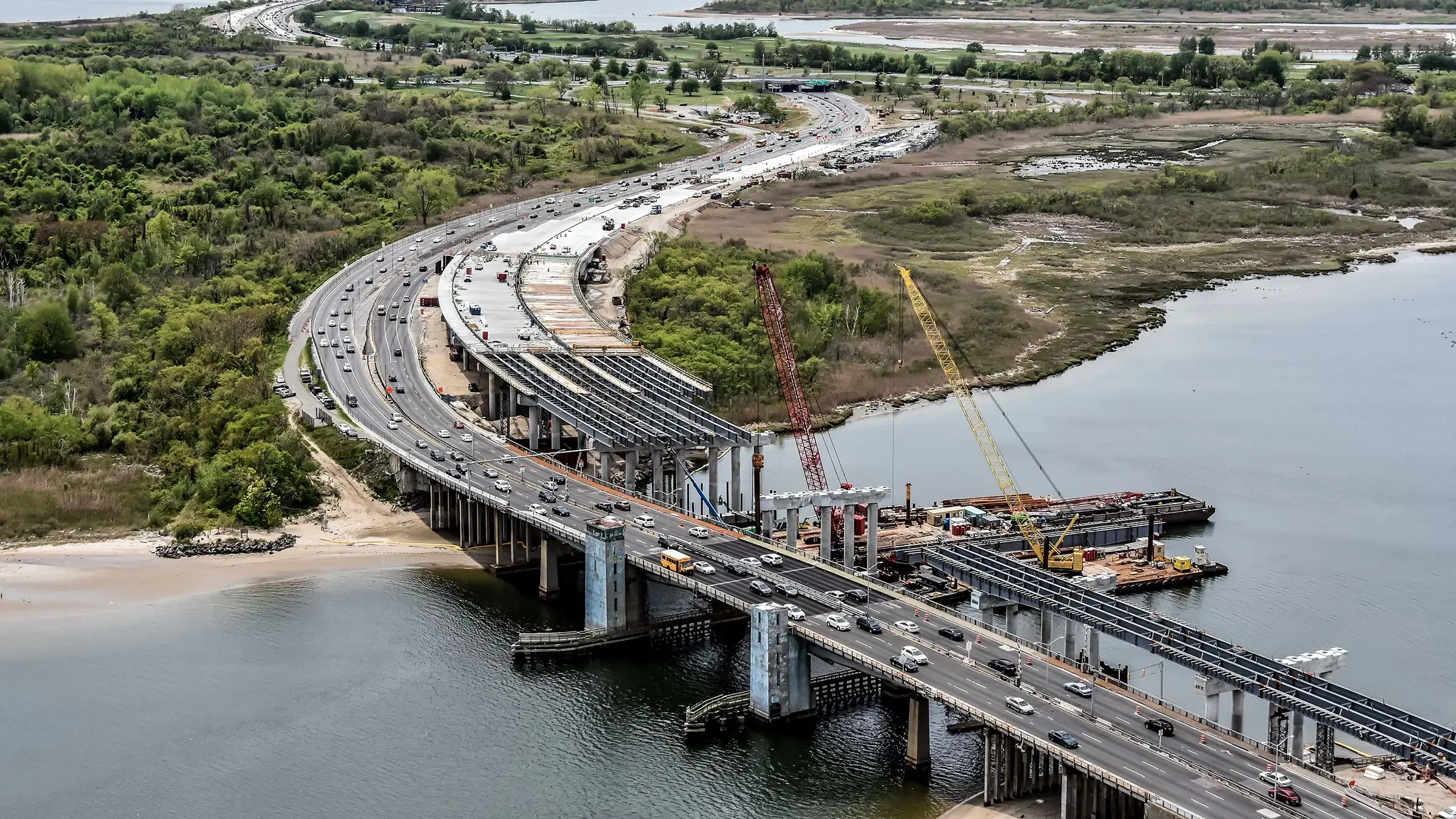 Aerial photo of bridge being built over a river.