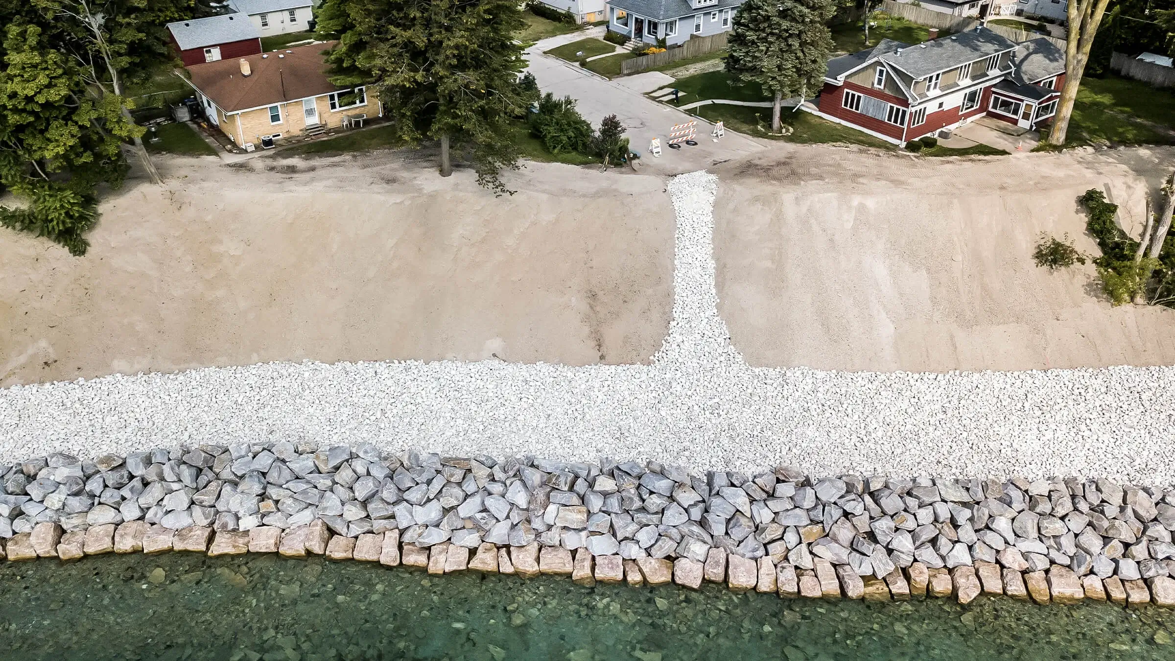 Riprap and armor stone are used to reinforce an eroding lakeshore