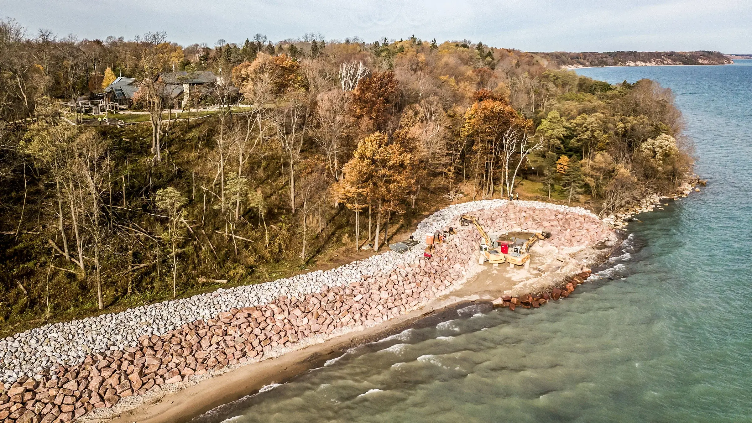 Riprap and armor stone are used to reinforce an eroding lakeshore