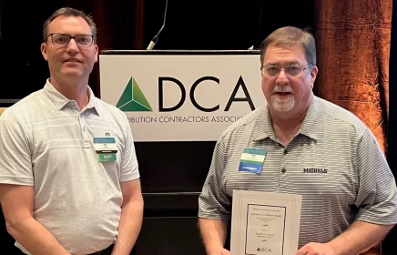 Michels Pacific Energy President Ben Nelson presents Michels Utility Services President Pete Fojtik with a DCA Safety Award