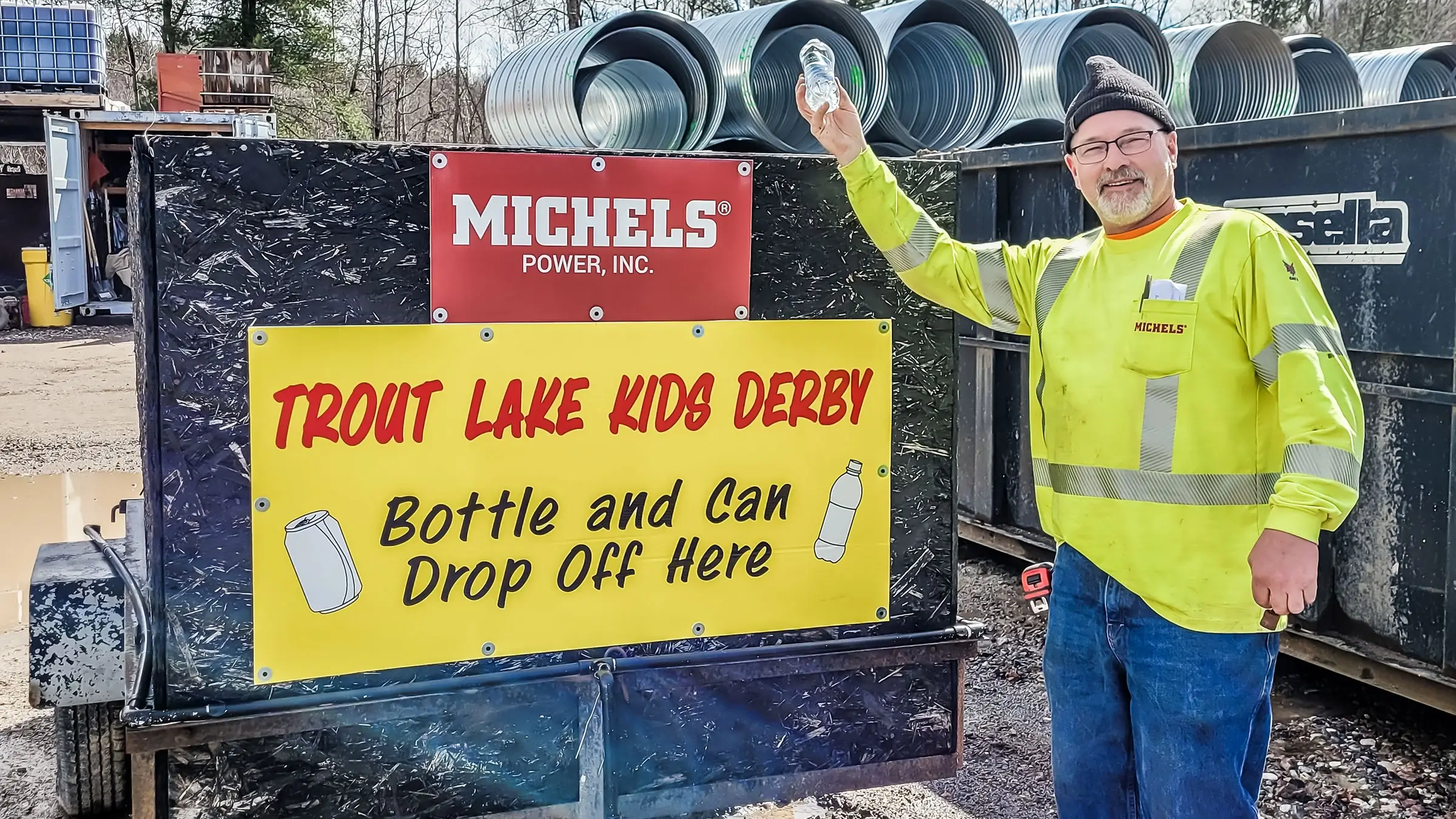 Man holding plastic water bottle ready to recycle in support of a cause