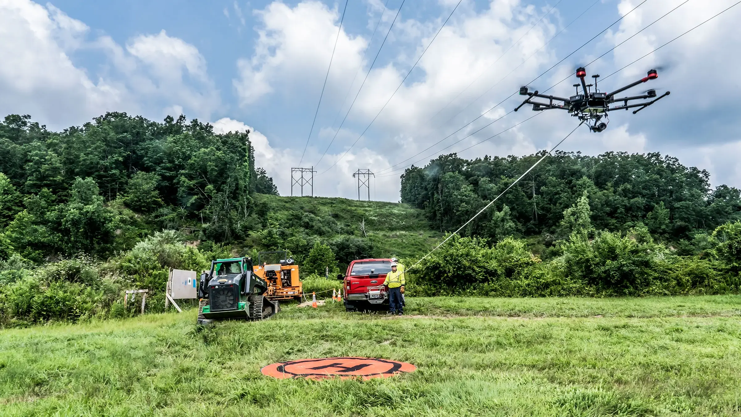 Michels Power drone pulls guide tape into place for new transmission powerline