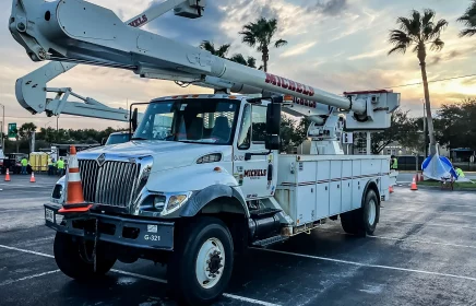 A Michels Power bucket truck in a Florida parking lot