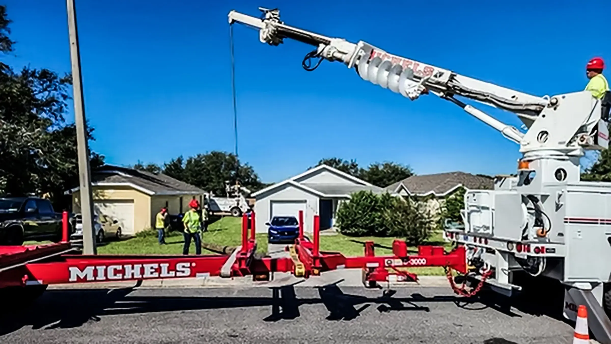 A power pole being replaced by a Michels power crew