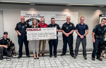 Elizabeth and Kevin Michels present check to local police department