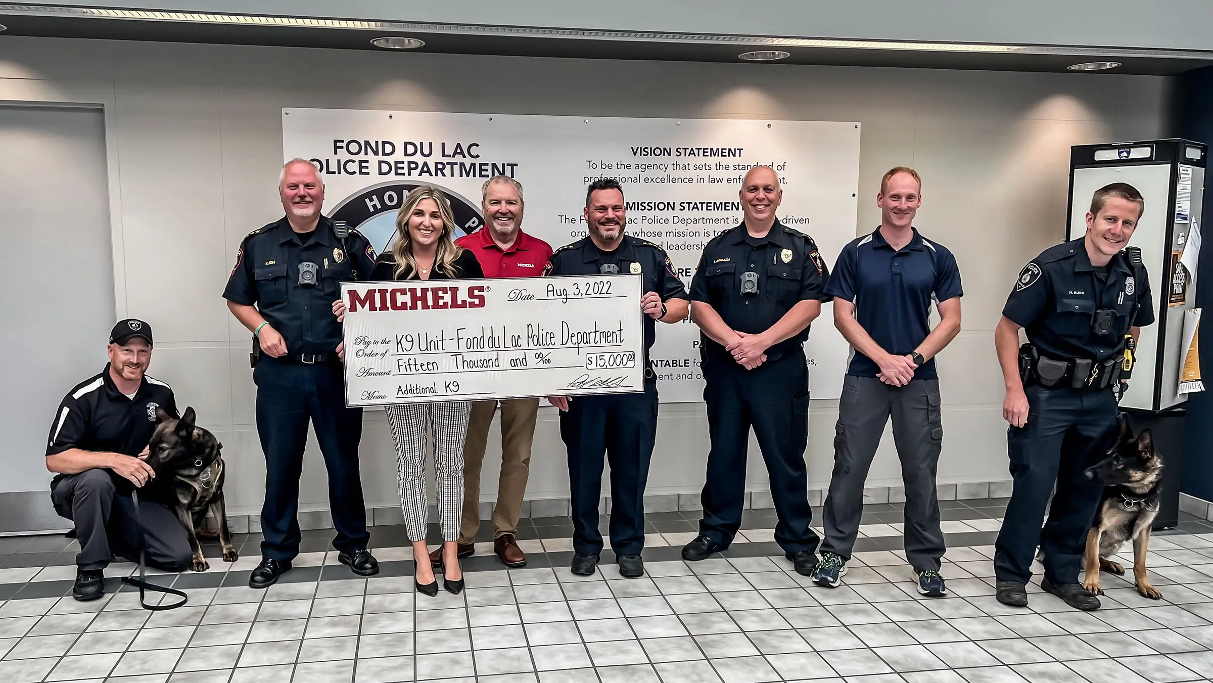 Elizabeth and Kevin Michels present check to local police department.