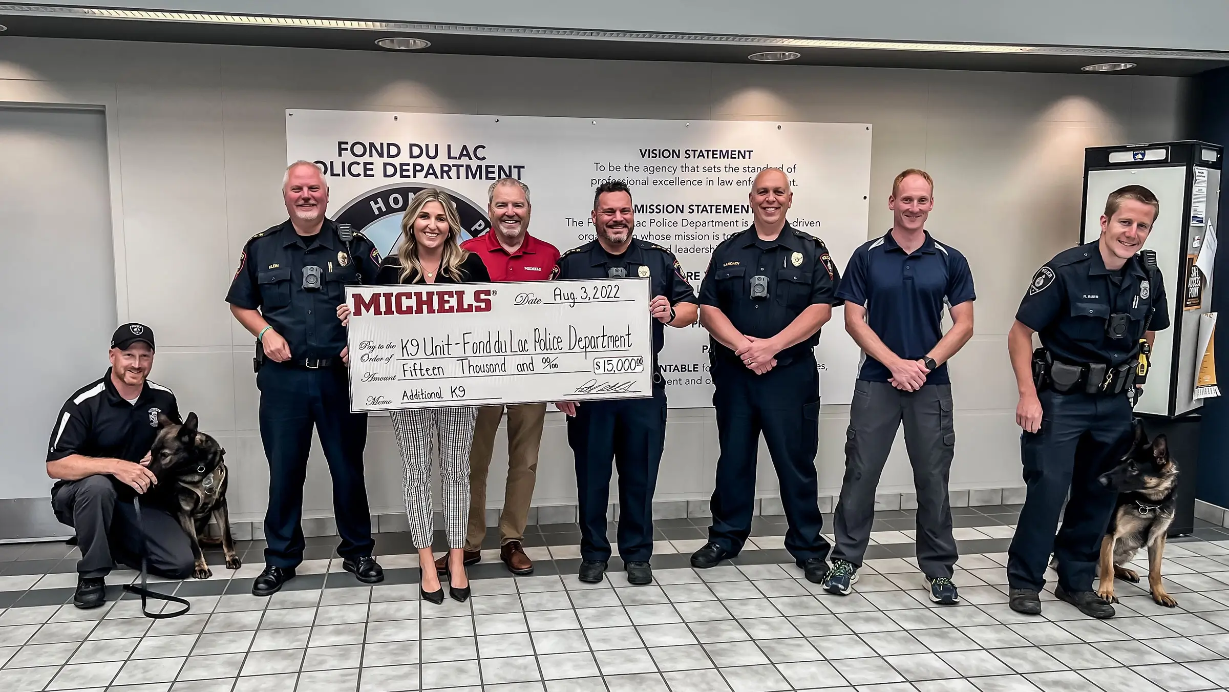 Elizabeth and Kevin Michels present check to local police department