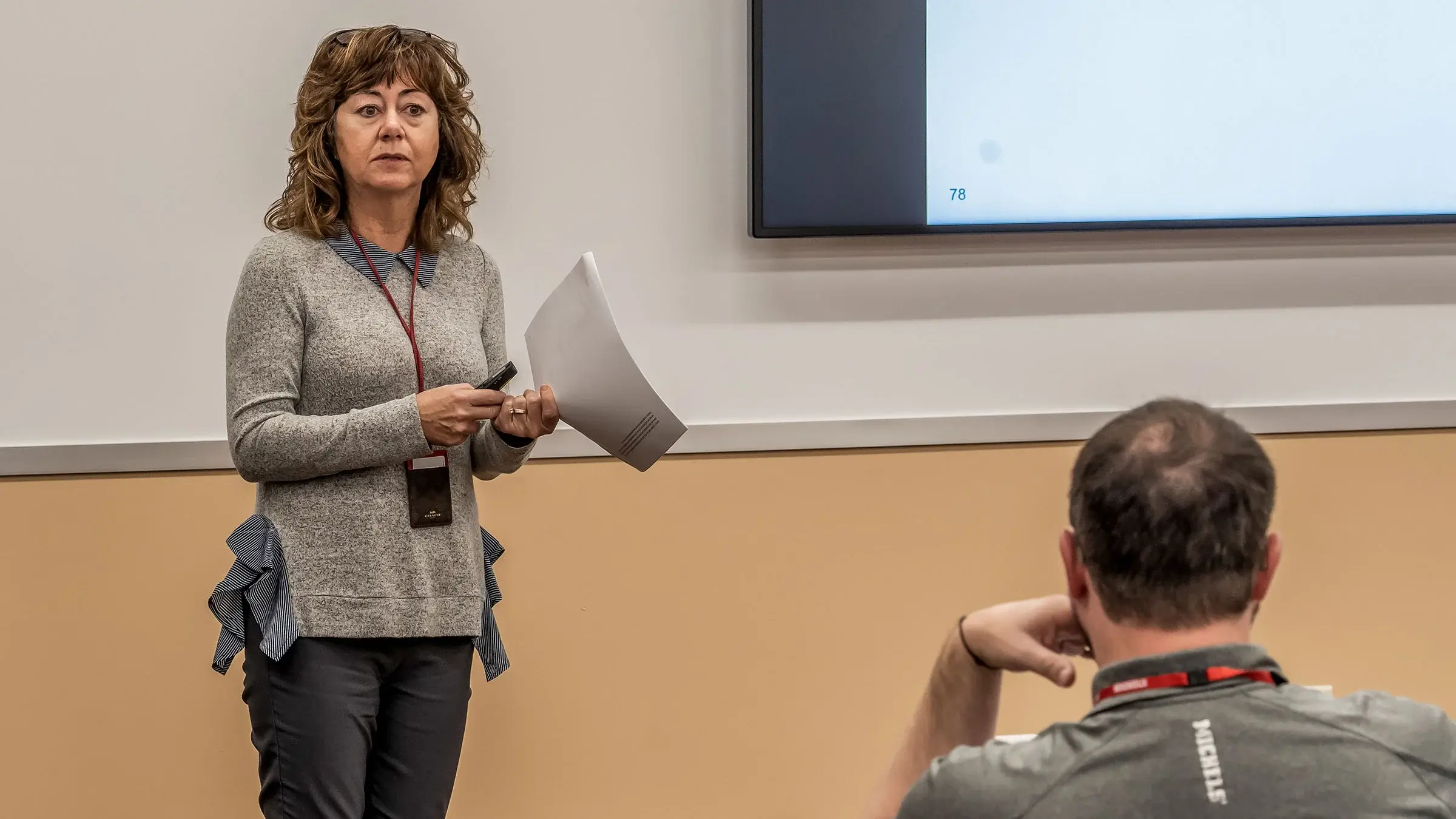 Woman standing at front of class