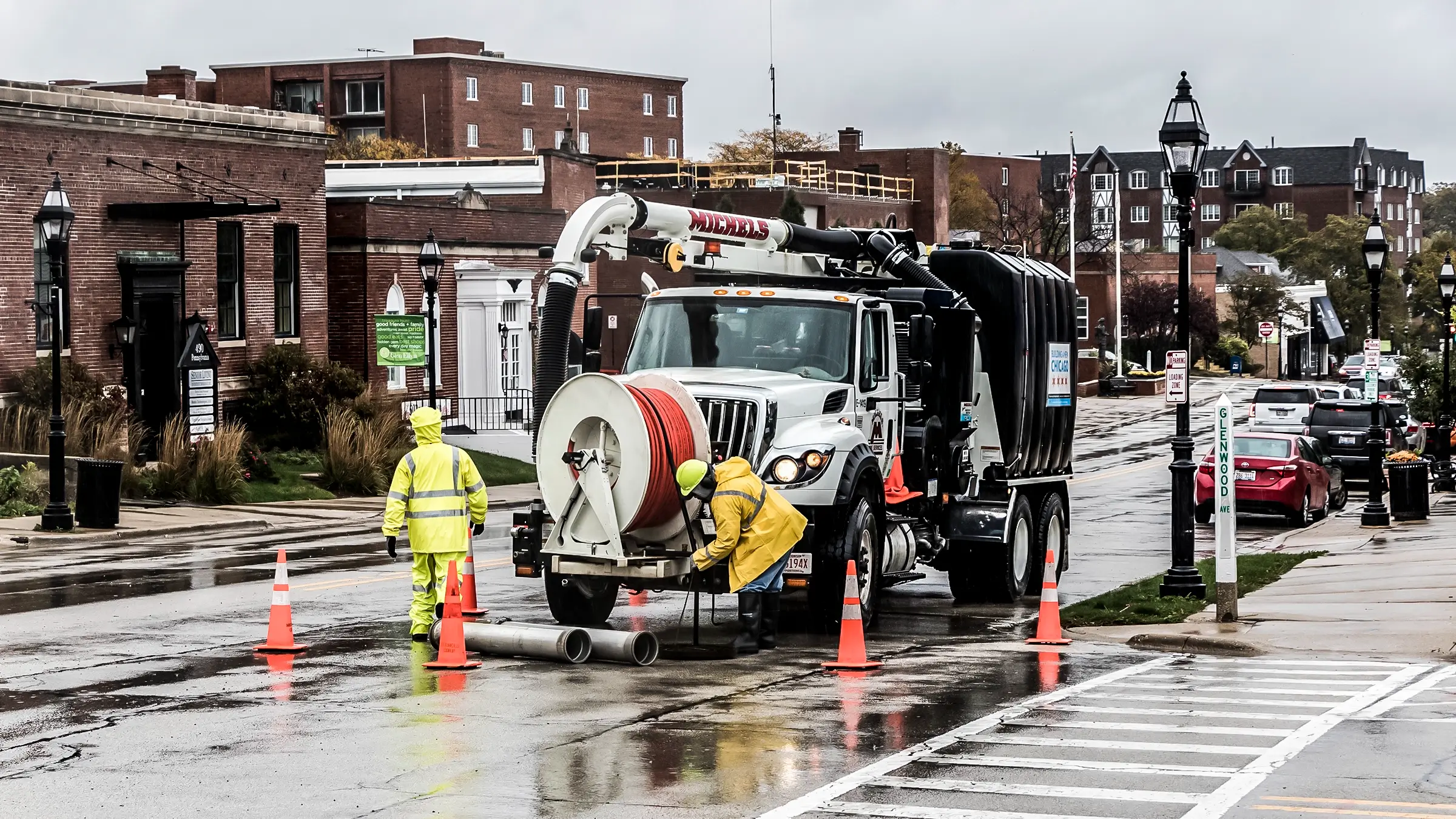 A remotely controlled camera is lowered into a utility hole to clean and inspect a sewer