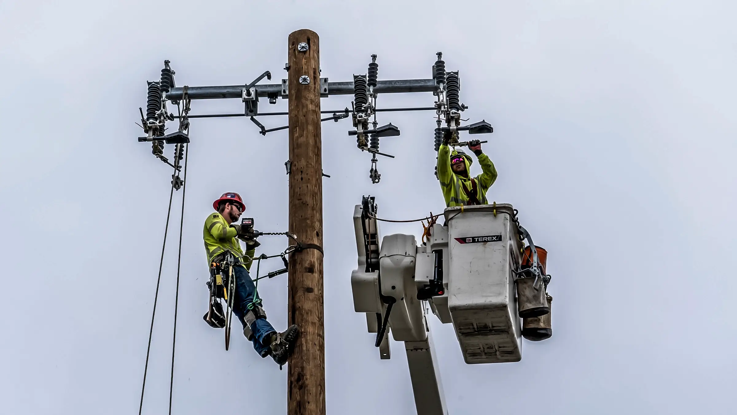 Michels Canada distribution line crews change out equipment on a power pole