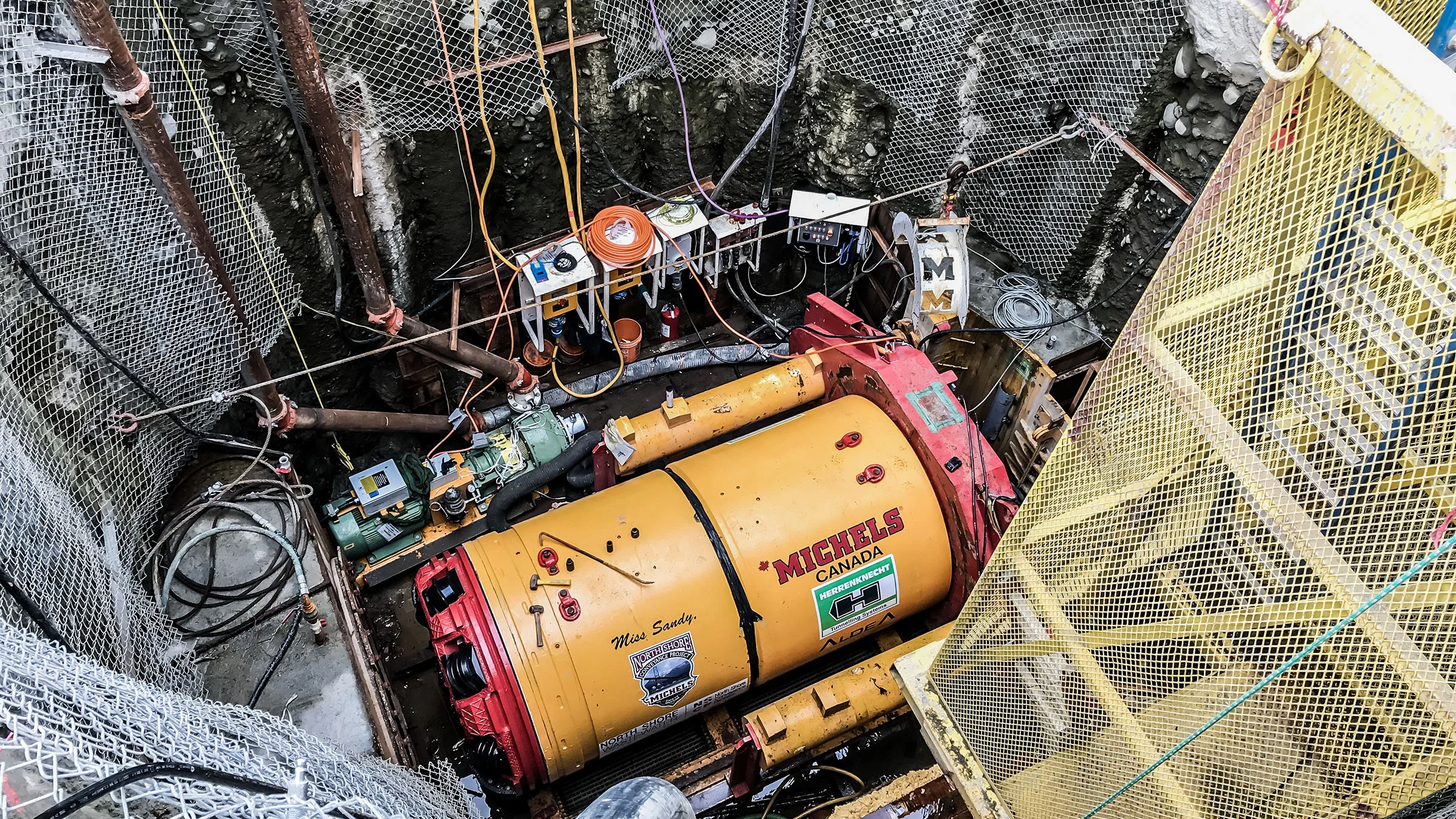 A tunneling drill at the bottum of a deep shaft.