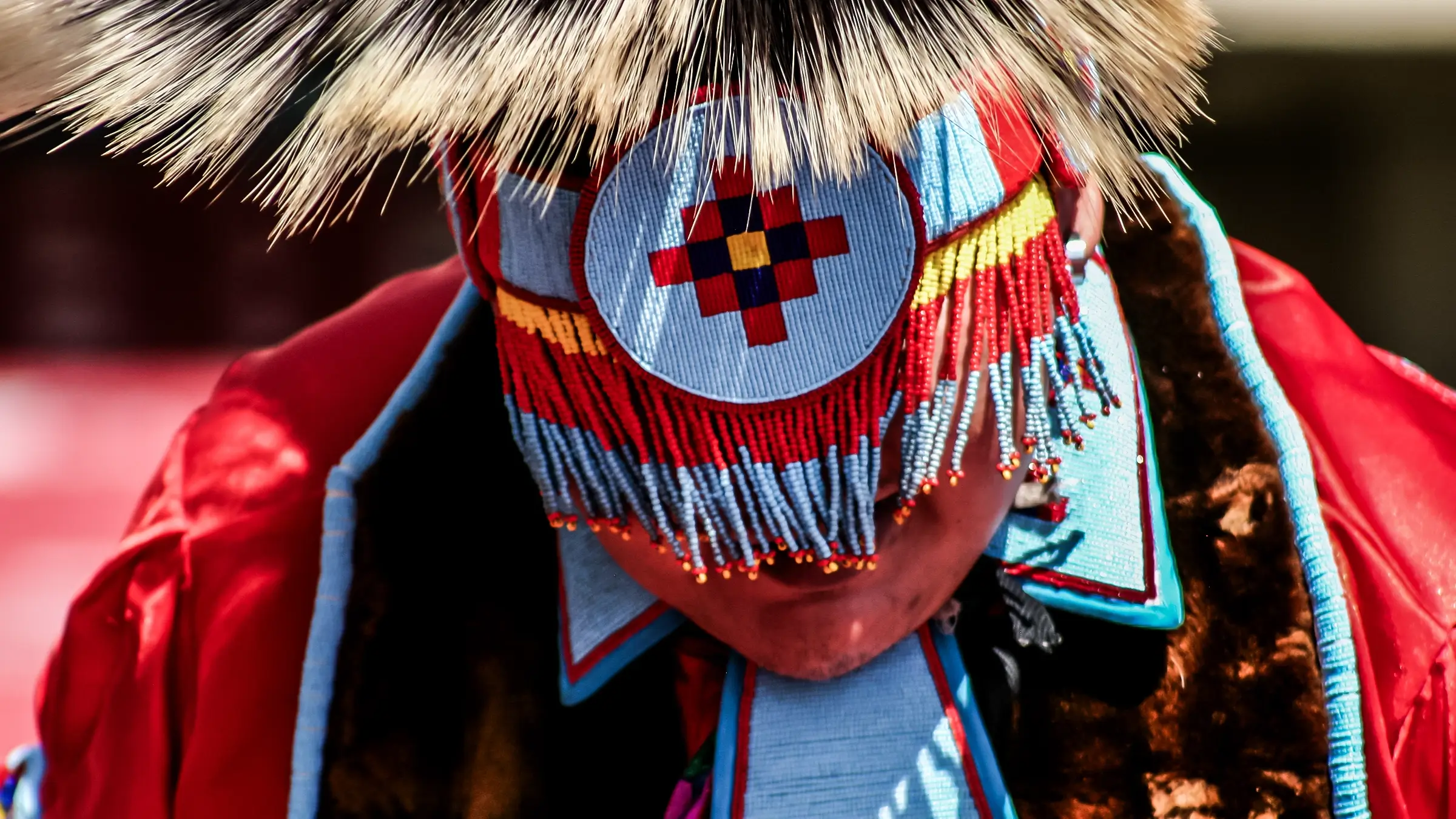A person dressed in Indigenous clothing