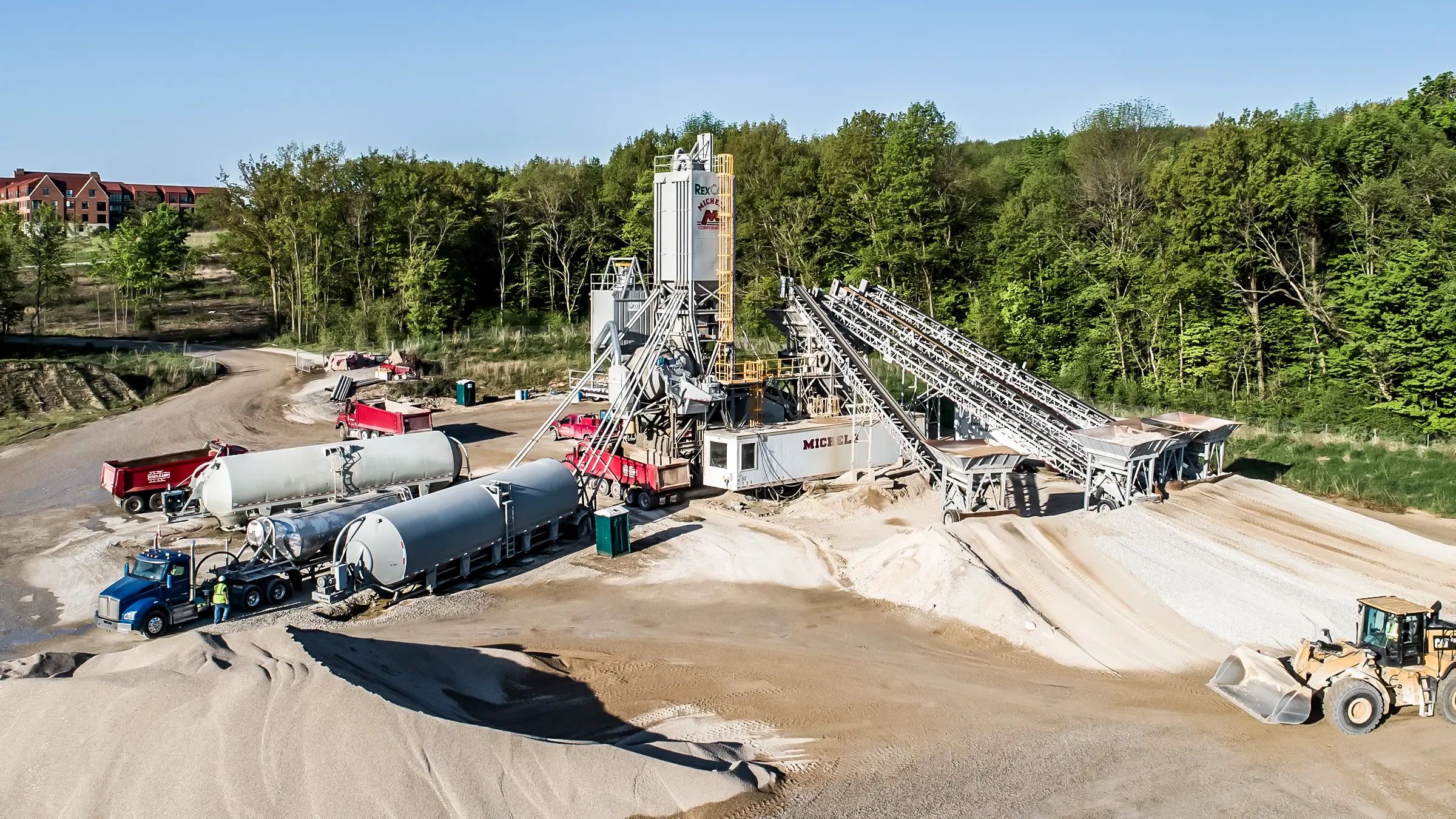 A batch plant producing aggregate material for a Road & Stone job.