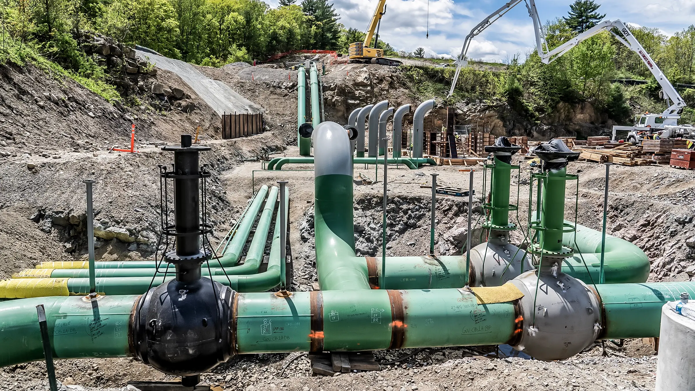 Compressor station facility pipelines in an abandoned quarry.